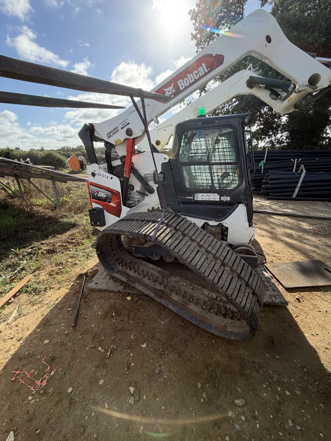 Bobcat T86 compact track loader during on-site track motor replacement by Hawes & Son Ltd